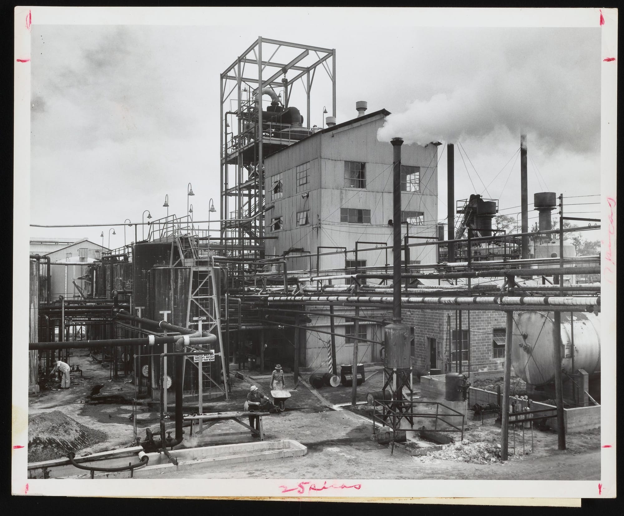 Exterior view of a rosin manufacturing facility at the Hercules Powder Company plant in Brunswick, Georgia with view of digesters on right-hand side.