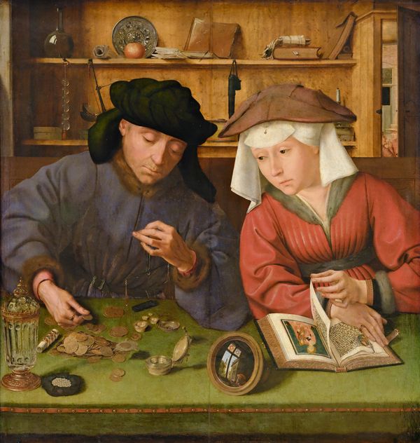A man in a dark robe weighs gold coins on a small balance while his wife, seated beside him, turns away from an illuminated devotional book to watch.