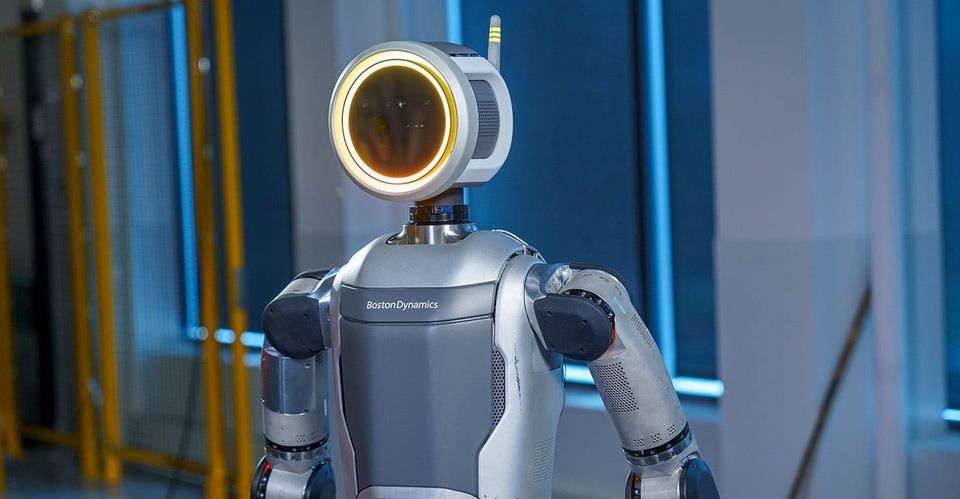 A humanoid robot with a round yellow light around its head.