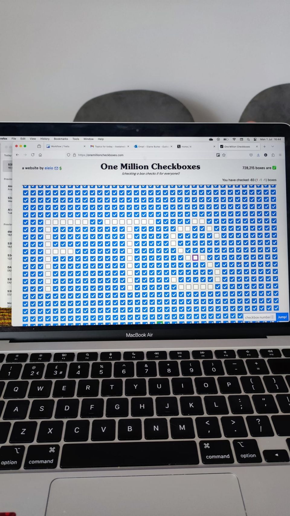 A computer screen open on the One Million Checkboxes website and the letters FTS are spelled out in unticked boxes.