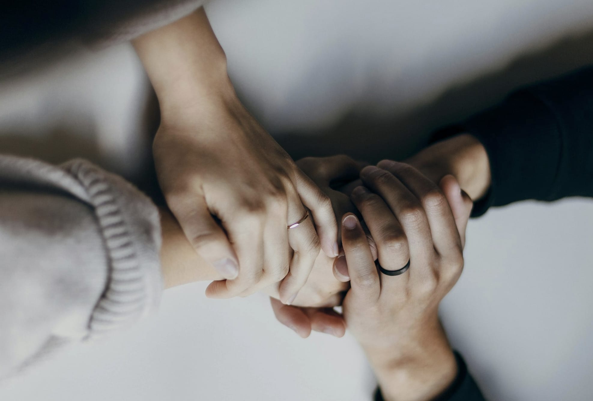 two people holding hands on table in comfort