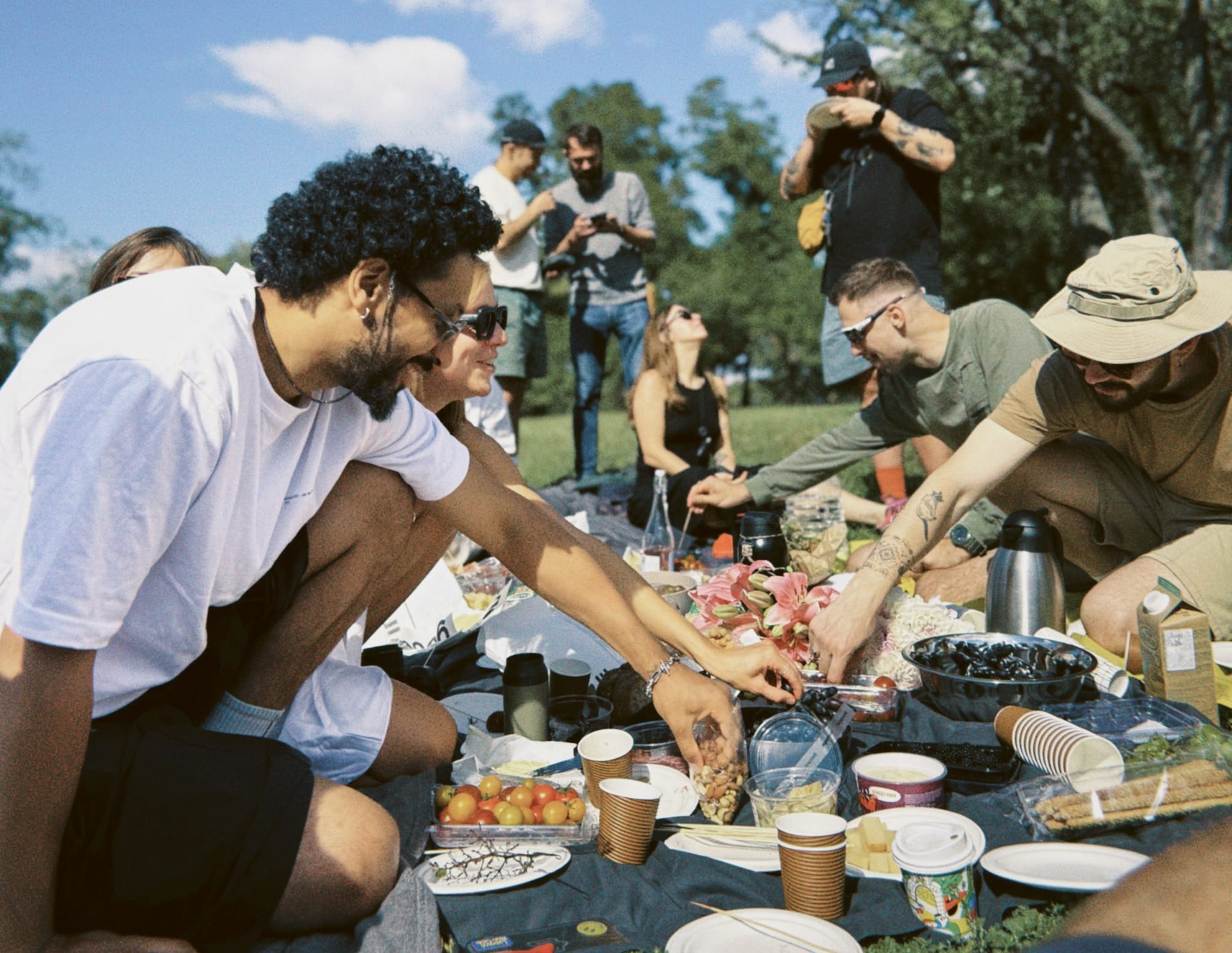 Friends enjoying a picnic in a sunny park