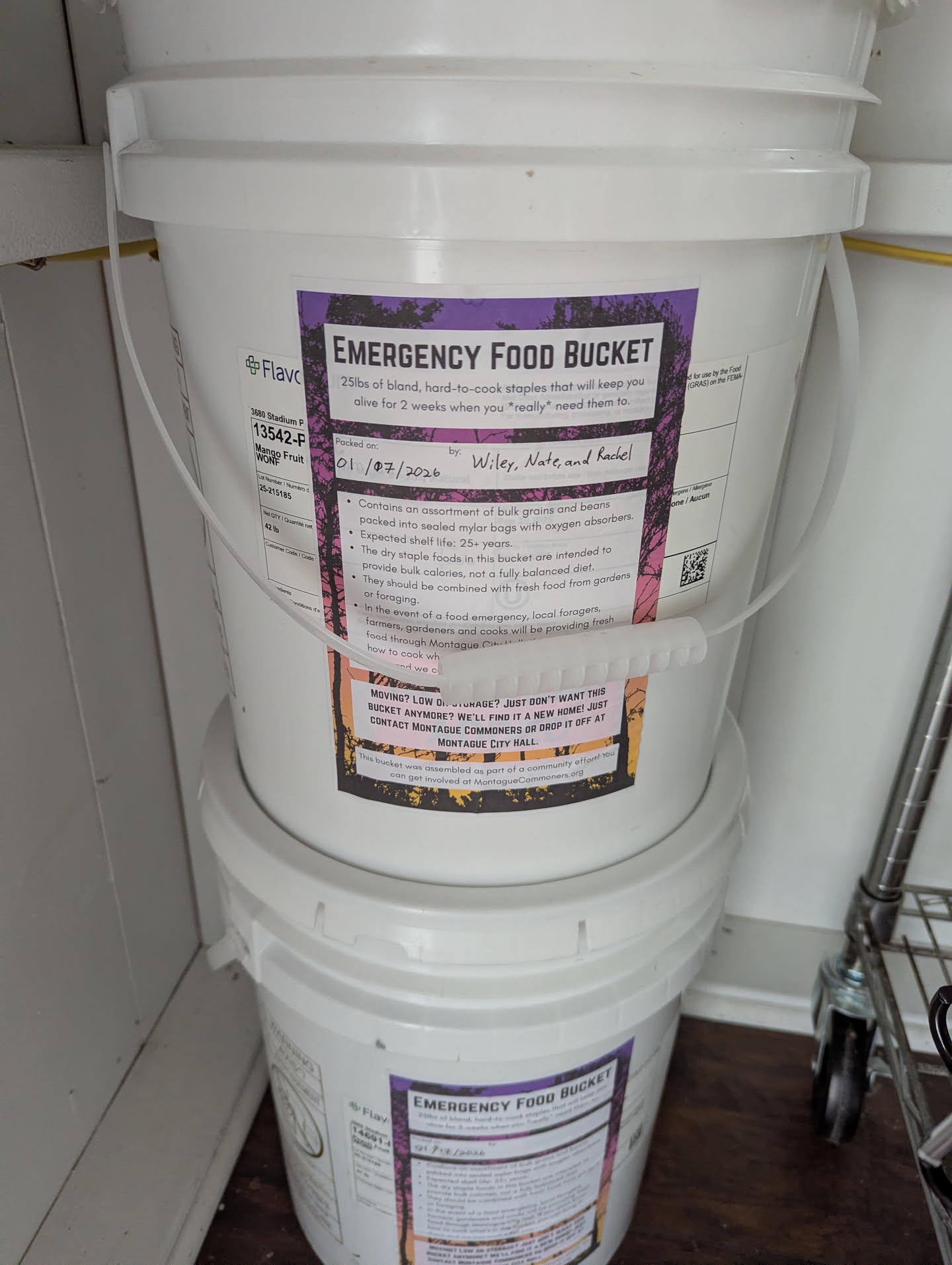 Two stacked emergency food buckets