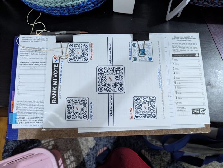 A Rank MI Vote petition clipboard