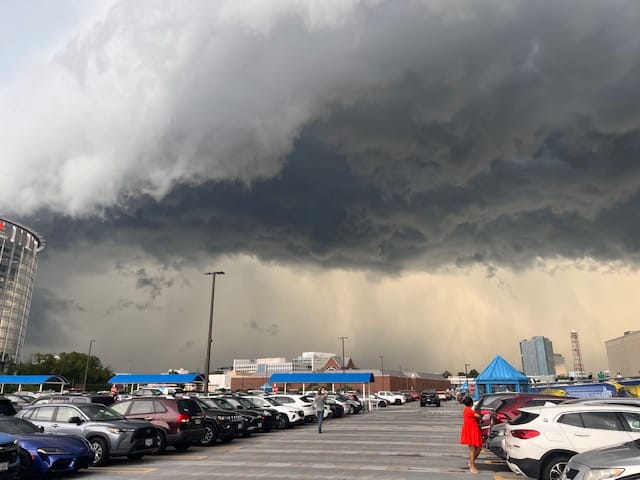 Very dense heavy rain approaching a parking lot at Tysons Mall June 12 - dark skies overhead