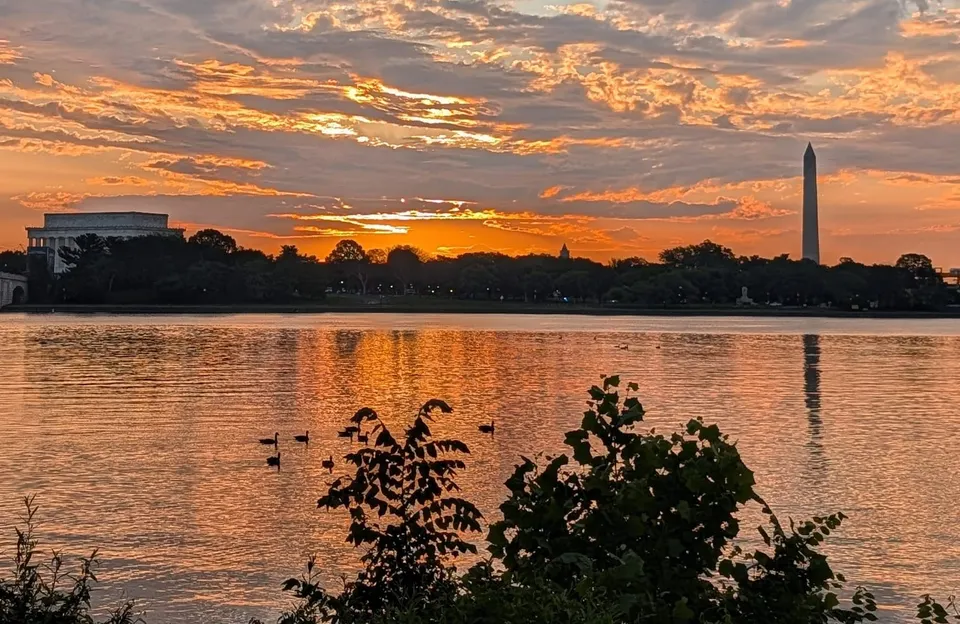 An orange sunrise over the Potomac River