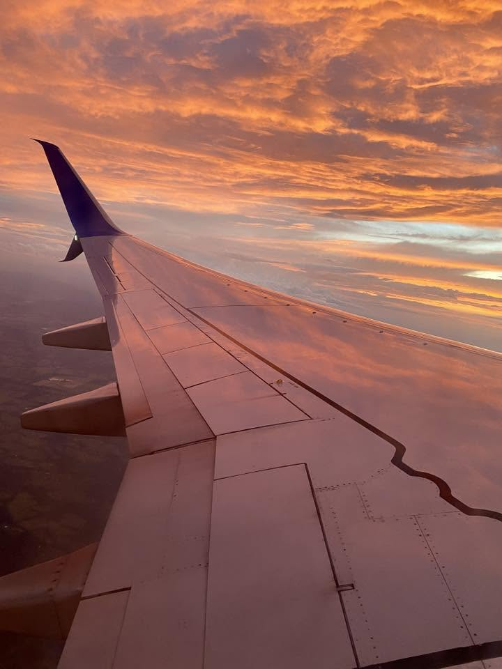 The sunset sky flying out of Dulles Airport Friday.