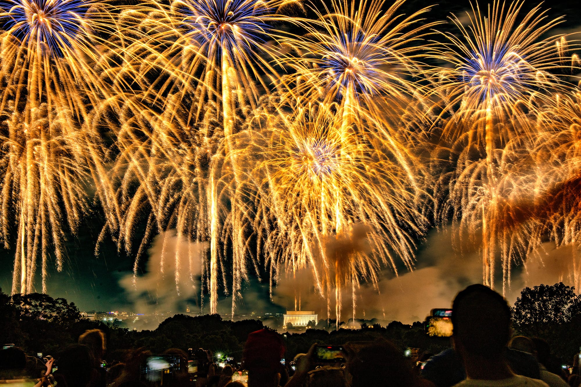 Multiple fireworks light up the night sky over DC