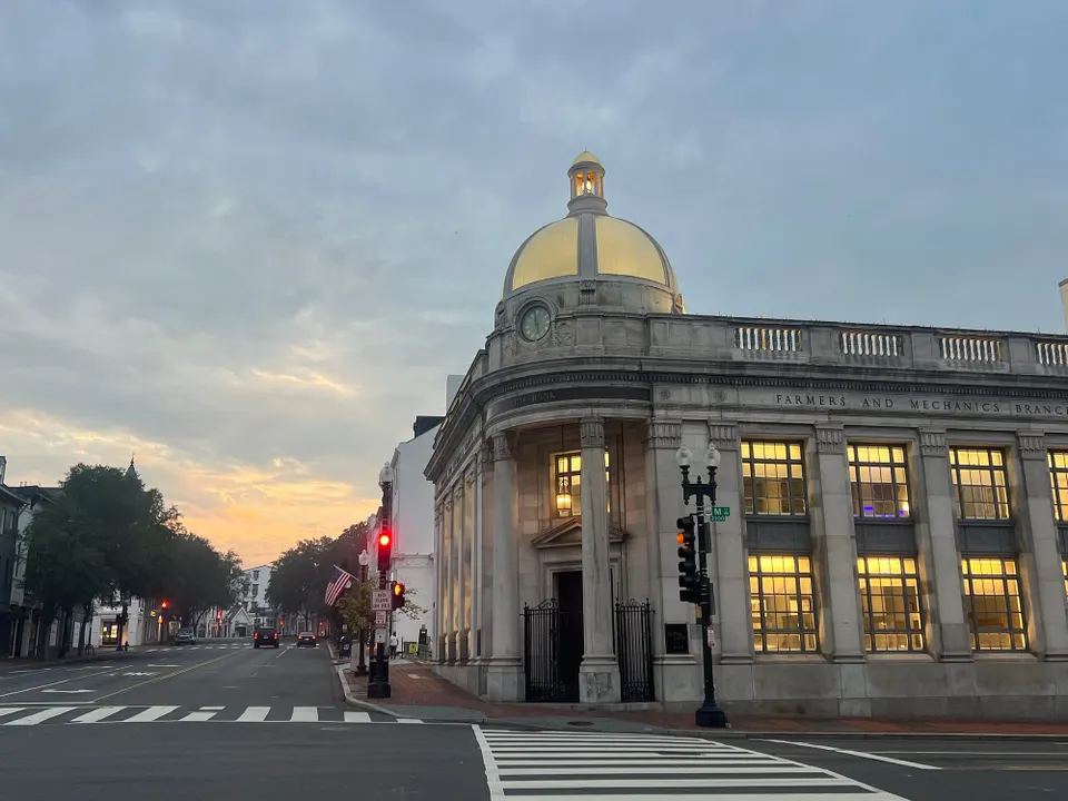 Mostly cloudy skies above the intersection of Wisconsin Avenue and M Street NW.