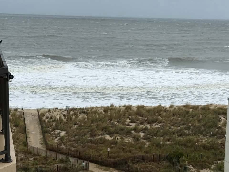 Seawater flows into the dunes of Ocean City, Maryland, Saturday morning.