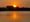 Photo of a hot summer sunrise over the Lincoln Memorial.