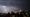 Photo of lightning striking near Washington Monument during Independence Day fireworks.