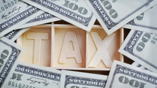 Comparing the U.S. Capitol (representing federal tax) and a state capitol building (representing state tax).