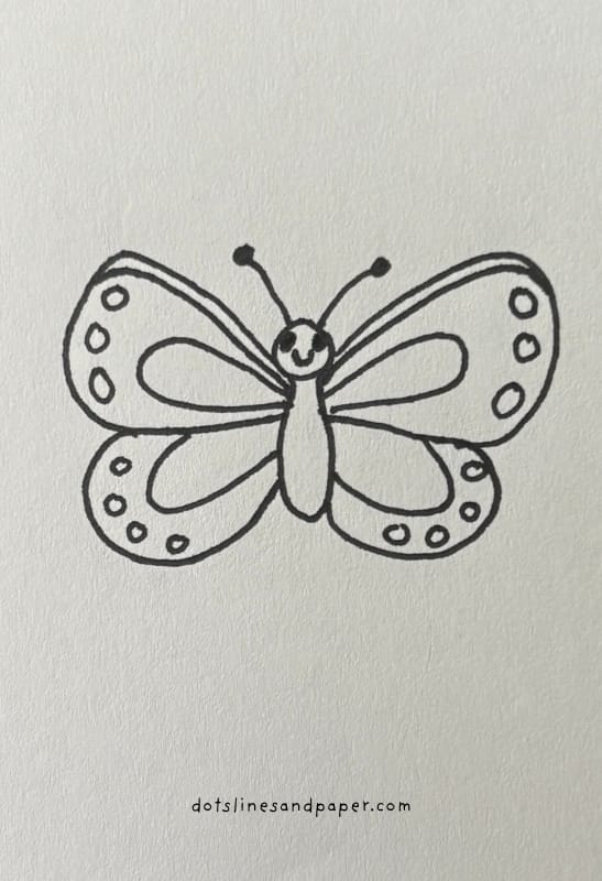 Easy and Cute Cartoon Butterfly Drawing Idea with a smiley face