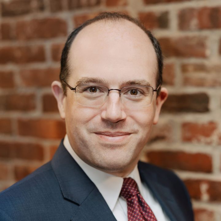 Photo of former DOJ attorney Mike Romano.