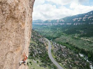Trudeau onsights Whiskey Gina, a 12b overhanging bolted