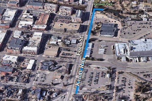 Satellite image from Google Earth showing a waterway running parallel to Ford St.