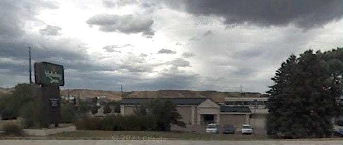 Dark photo of the Holiday Inn, heavy skies overhead
