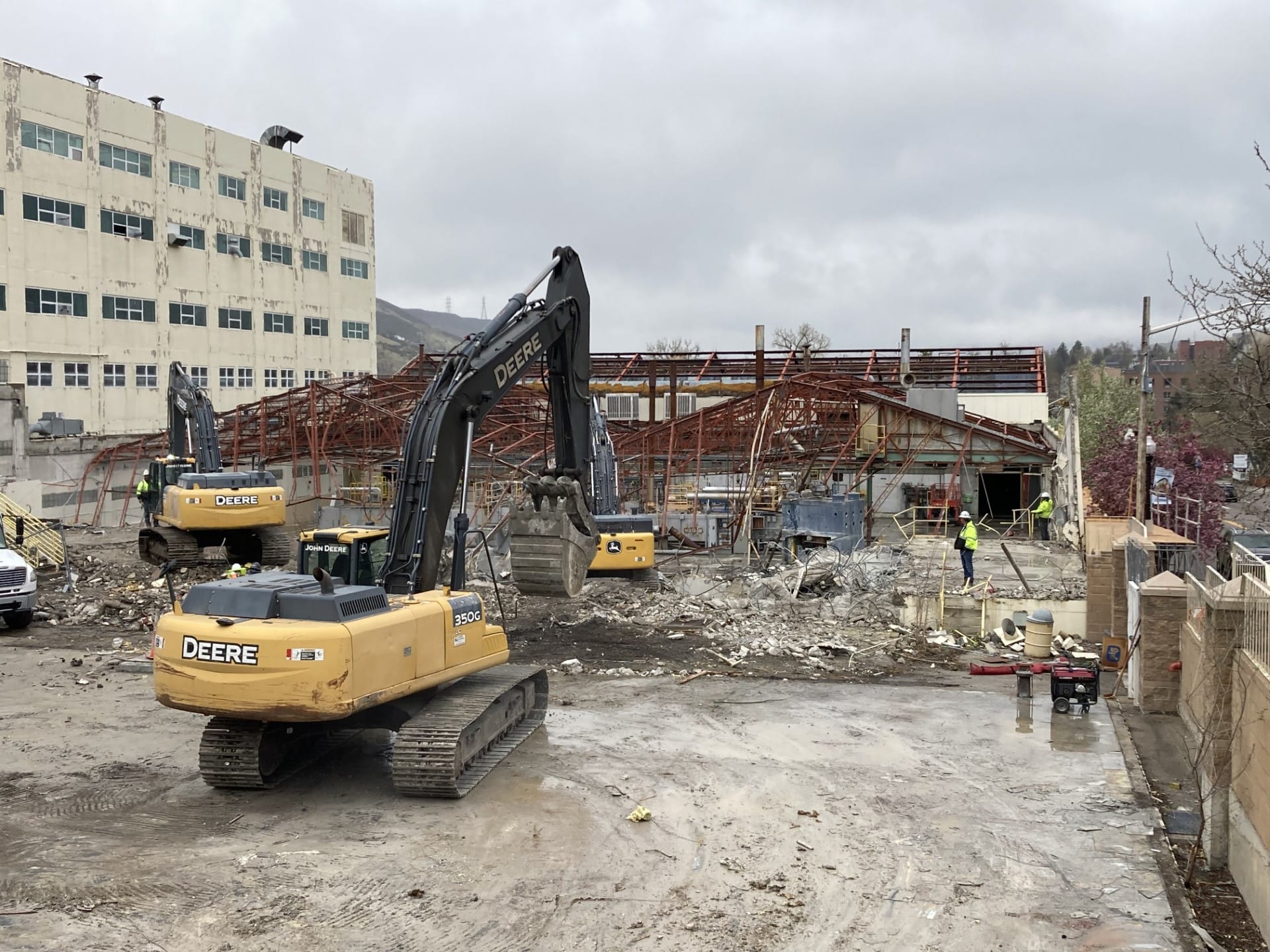 Three excavators pulled down the walls and roof beams of the second building