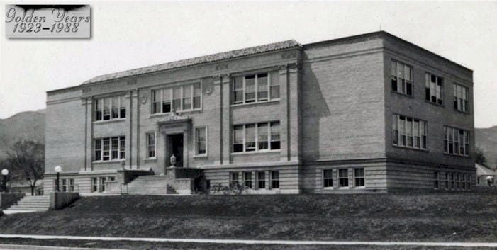 2-story brick school building with a long staircase in front