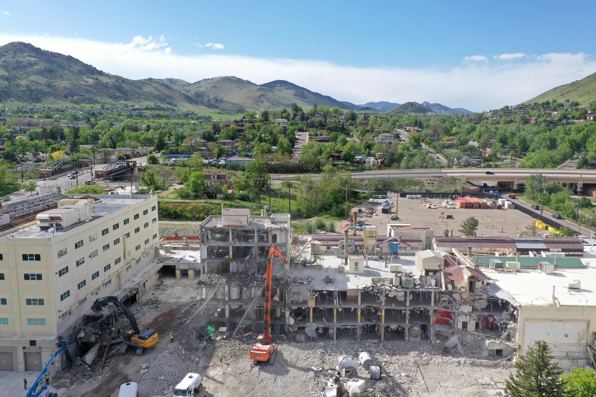 Cranes pulling down industrial buildings