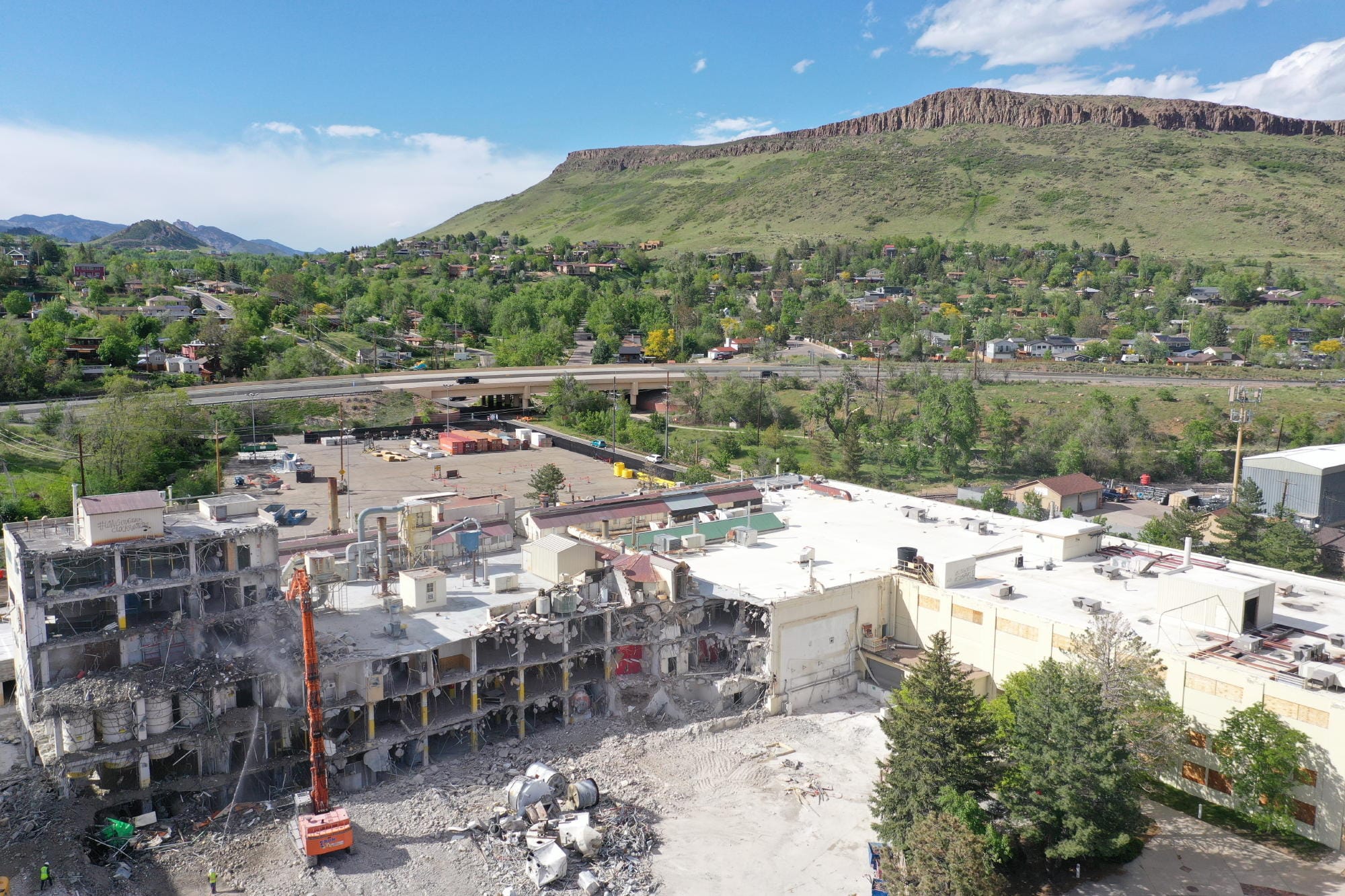Cranes pulling down industrial buildings