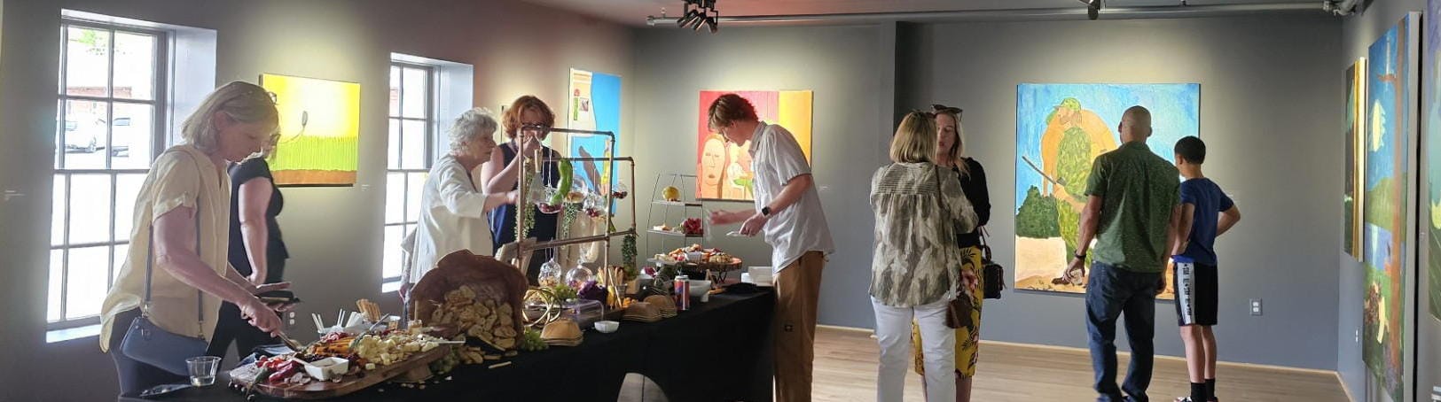 gallery with casement windows, large paintings on the walls, and buffet table - 9 people