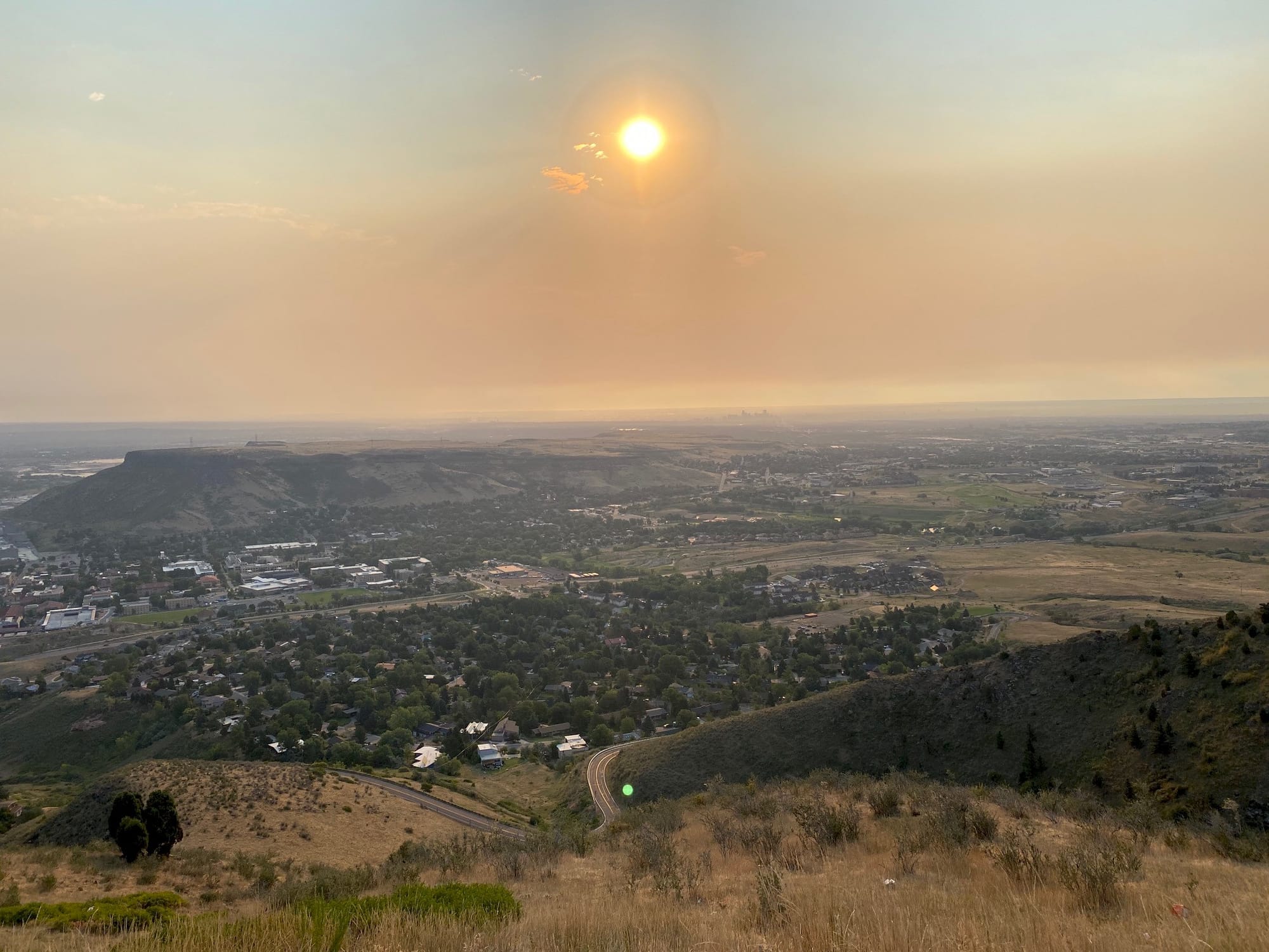 murky, orange-tinted midday sky - South Table Mountain seen from Lookout Mountain