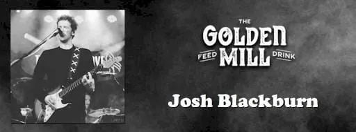 Josh Blackburn playing at the Golden Mill - man at microphone, holding a guitar.