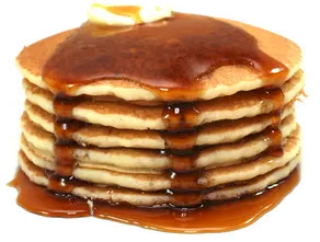stack of pancakes, dripping with syrup and topped with a pat of butter