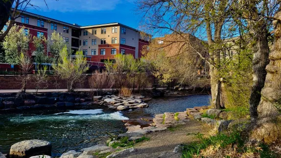 Clear Creek through downtwon Golden - greenery just beginning to emerge along the sides.