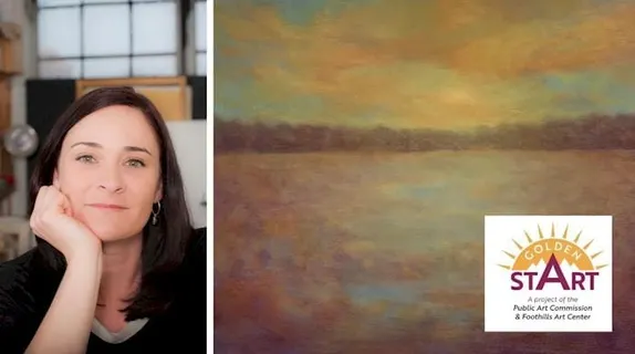 woman with long brown hair on left side, painting of sunset on right side