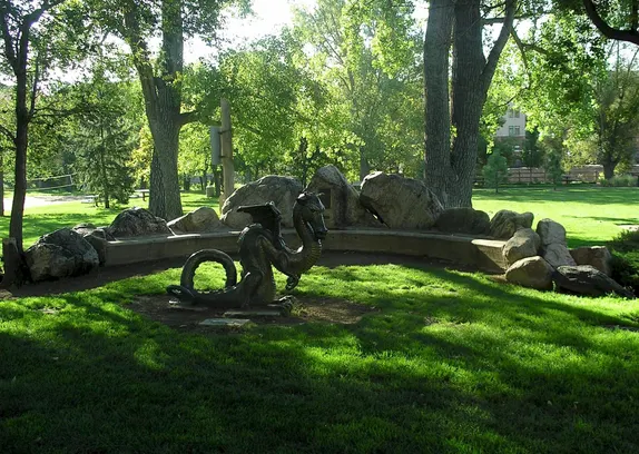 small bronze statue of a dragon in Parfet Park