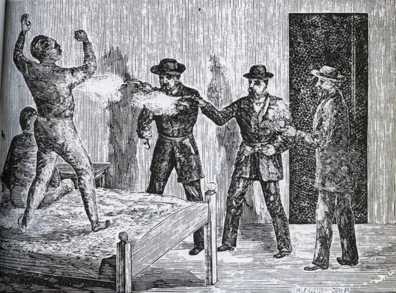pen & ink drawing show three men pointing guns at a man standing on a bed.  2 of the guns appear to be firing.