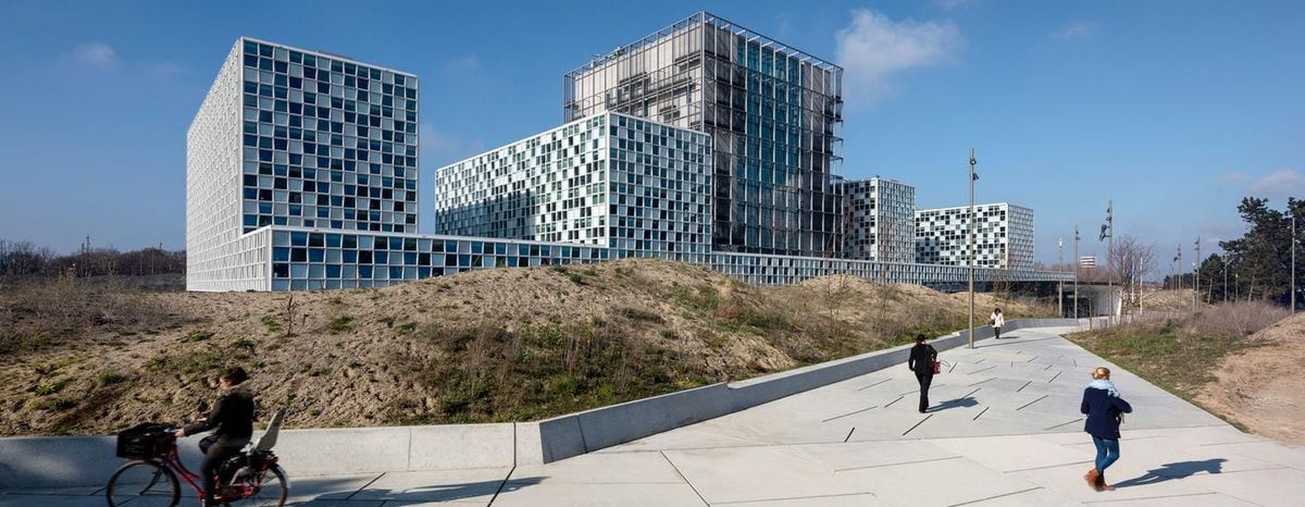 A large modern building with windows that look like mosaic bathroom tiles