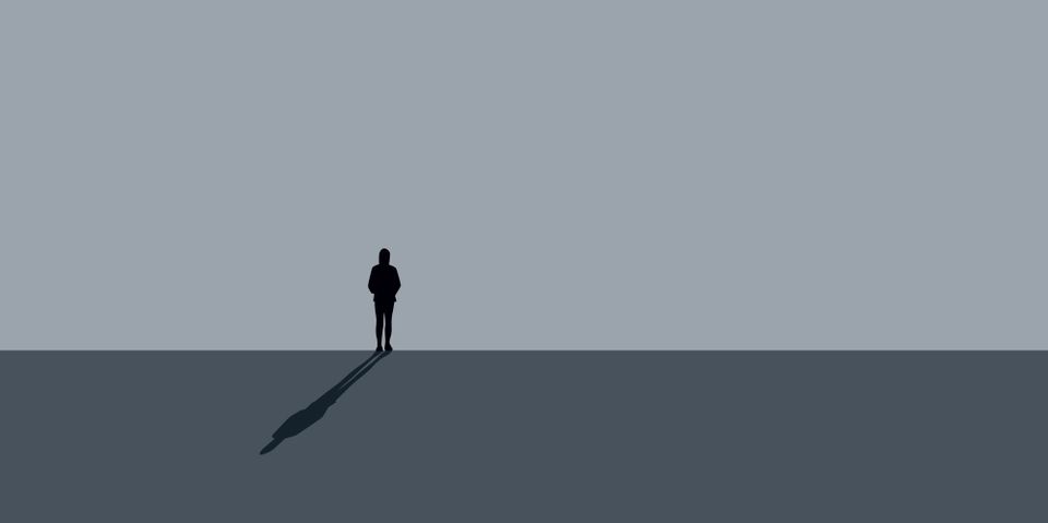 An illustration of a woman standing alone in front of a grey wall with only her shadow behind her