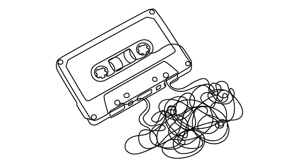The tape of a cassette tape is tangled and outside the cassette