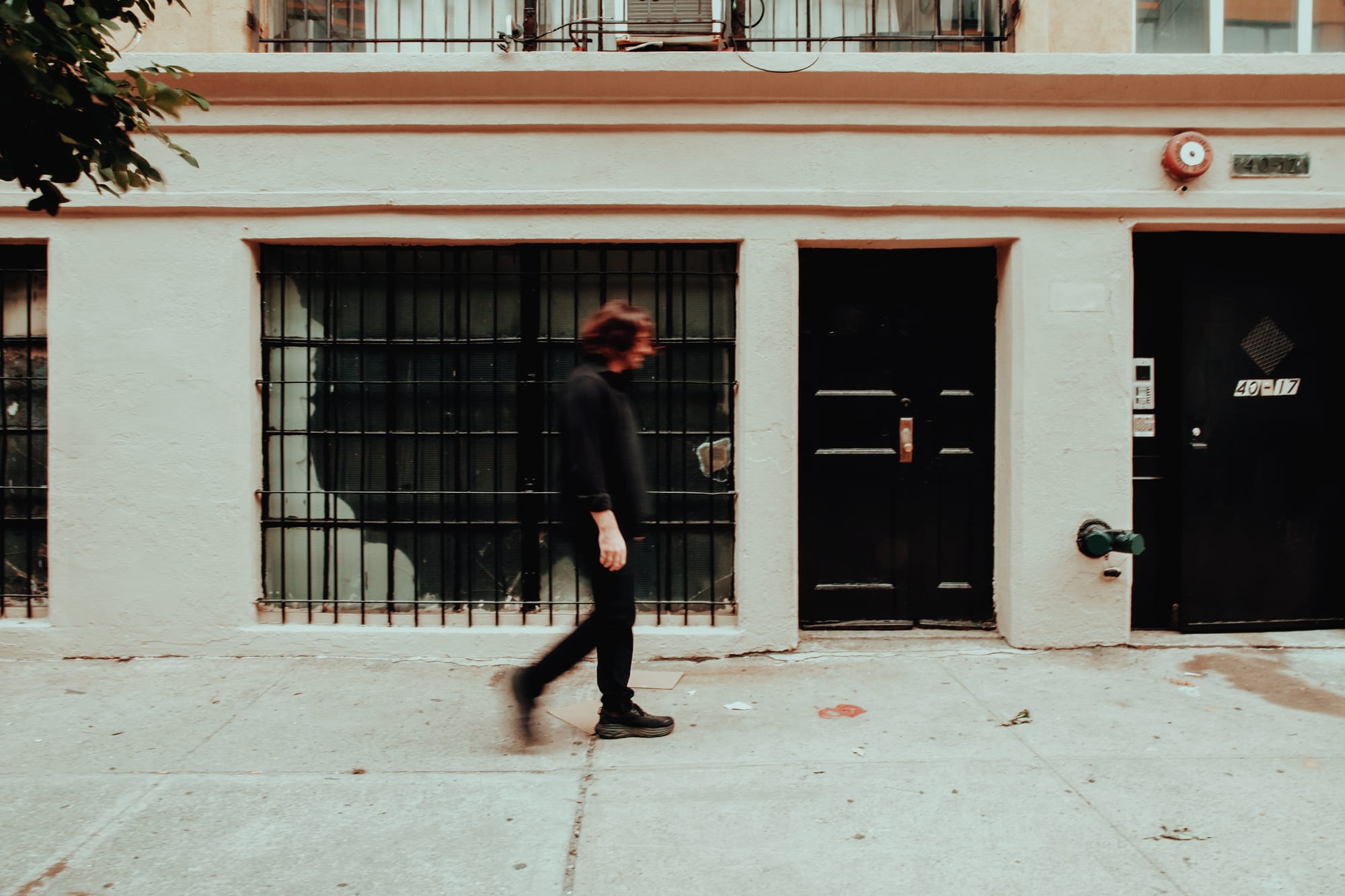 Noah Preminger walking down a street. Photo by Savannah Lauren.