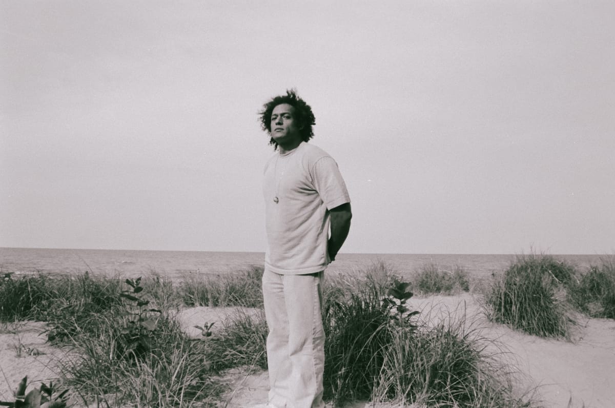 Makaya McCraven standing on a beach - Photo by Shannon Marks