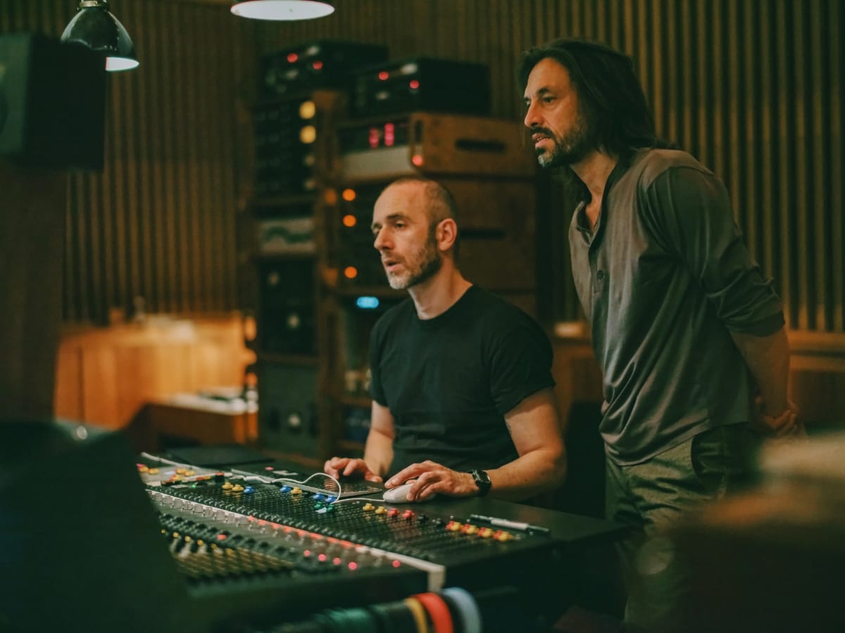 Engineer Antonio Pulli and Aukai at mixing console in Funkhaus studio, wood-paneled room with equipment visible in background. Photo by Jan Dellügge.