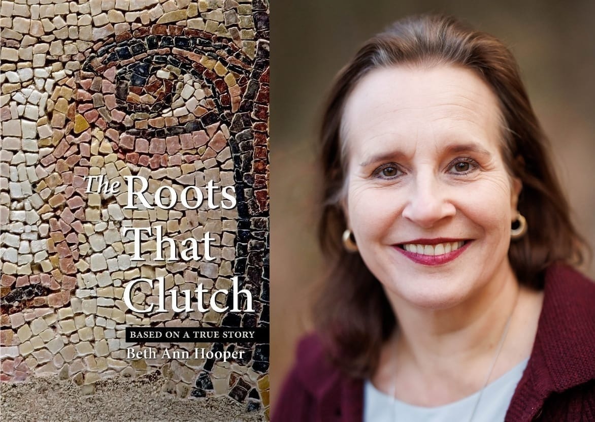 Beth Ann Hooper smiles in a portrait beside the cover of her book The Roots That Clutch, which features a mosaic eye detail and the subtitle "Based on a True Story."