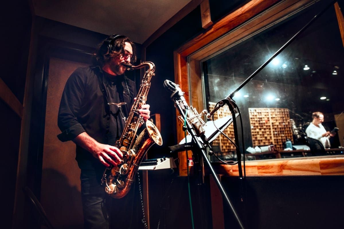 Noah Preminger playing saxophone in the recording studio. Photo by Savannah Lauren.