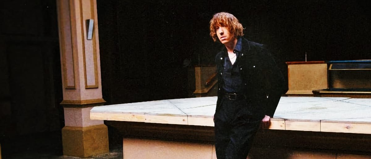 Daniel Avery stands against the bar in an empty nightclub. Photo by Kalpesh Lathigra.