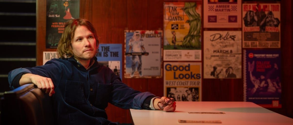 Jens Kuross seated at a booth in a pub. - Photo by Mark Oliver