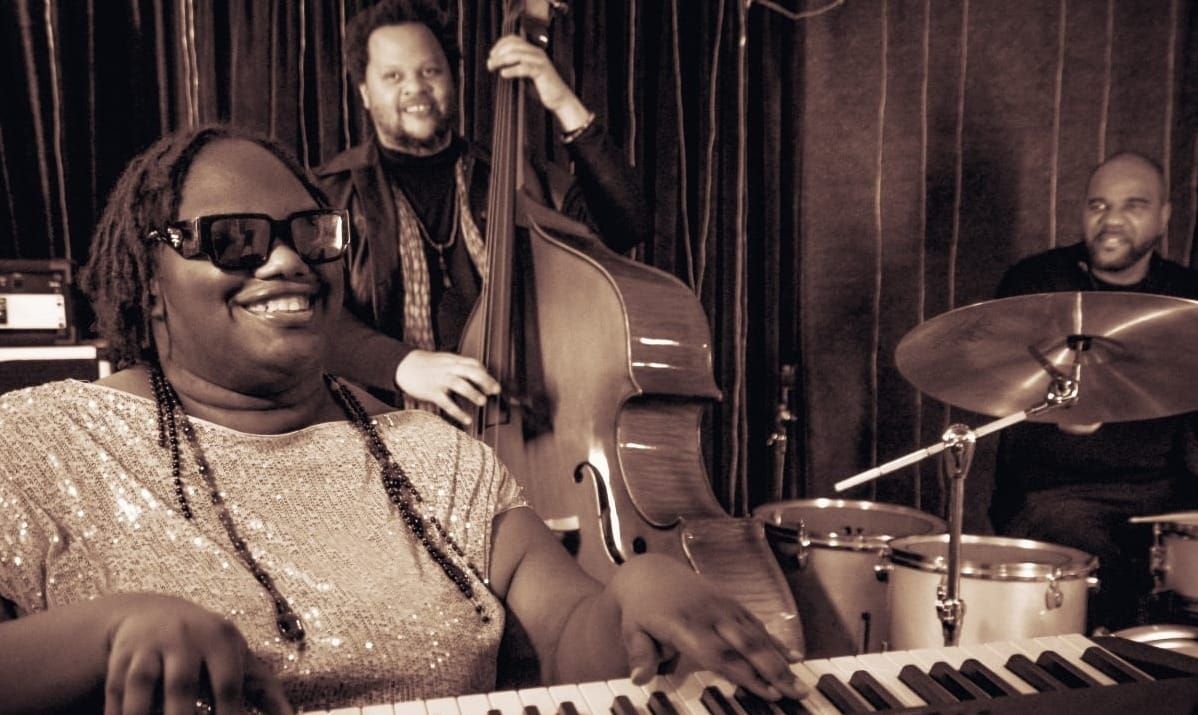 Brittany Davis performs with bassist Evan Flory-Barnes and drummer D'Vonne Lewis. Photo by Lance Mercer.