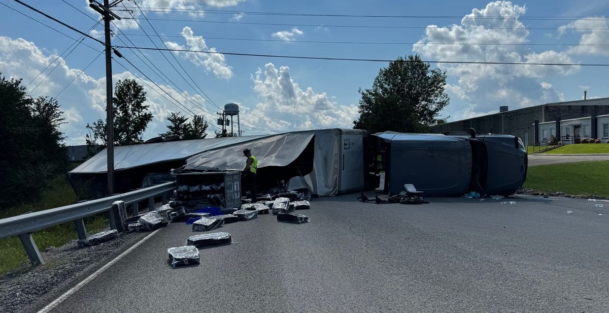 Semi lands on side after swerving to avoid deer