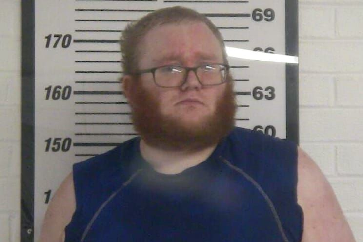 Travis charged with assaulting mother, stepfather