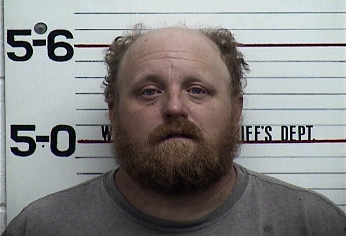 Horns, Profanities and a Harassment Charge