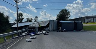 Semi lands on side after swerving to avoid deer