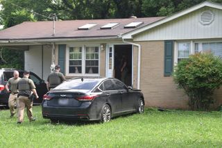 Warrant uncovers drugs, guns & money at White St. home
